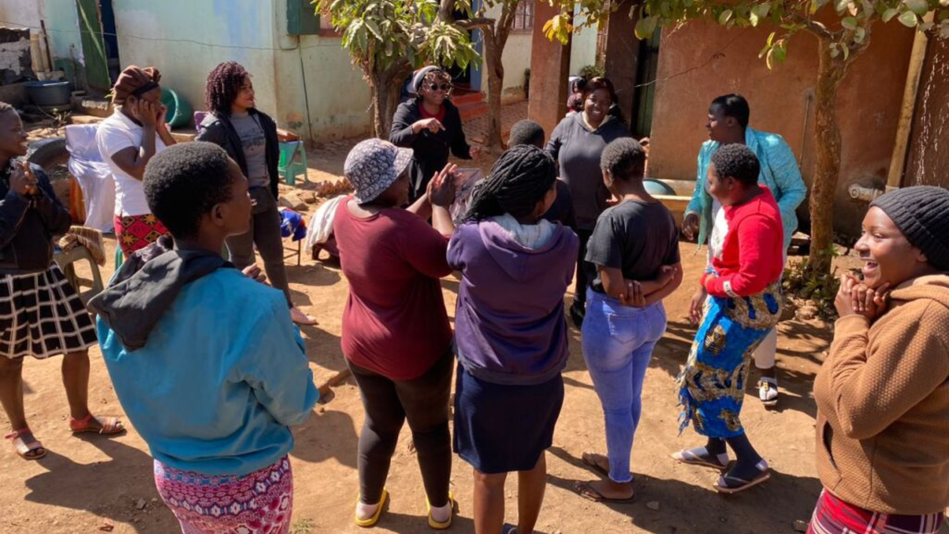 Rumbie talking to ladies about the Shining Star programme