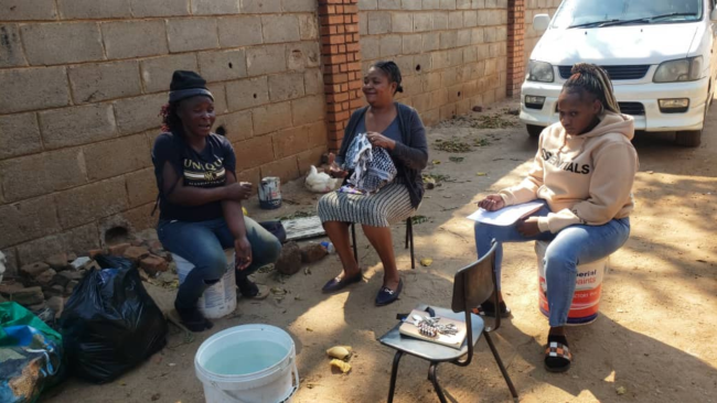 Anenyasha (left) with two of the Nehemiah team