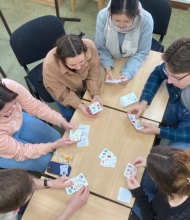 people playing cards on a table